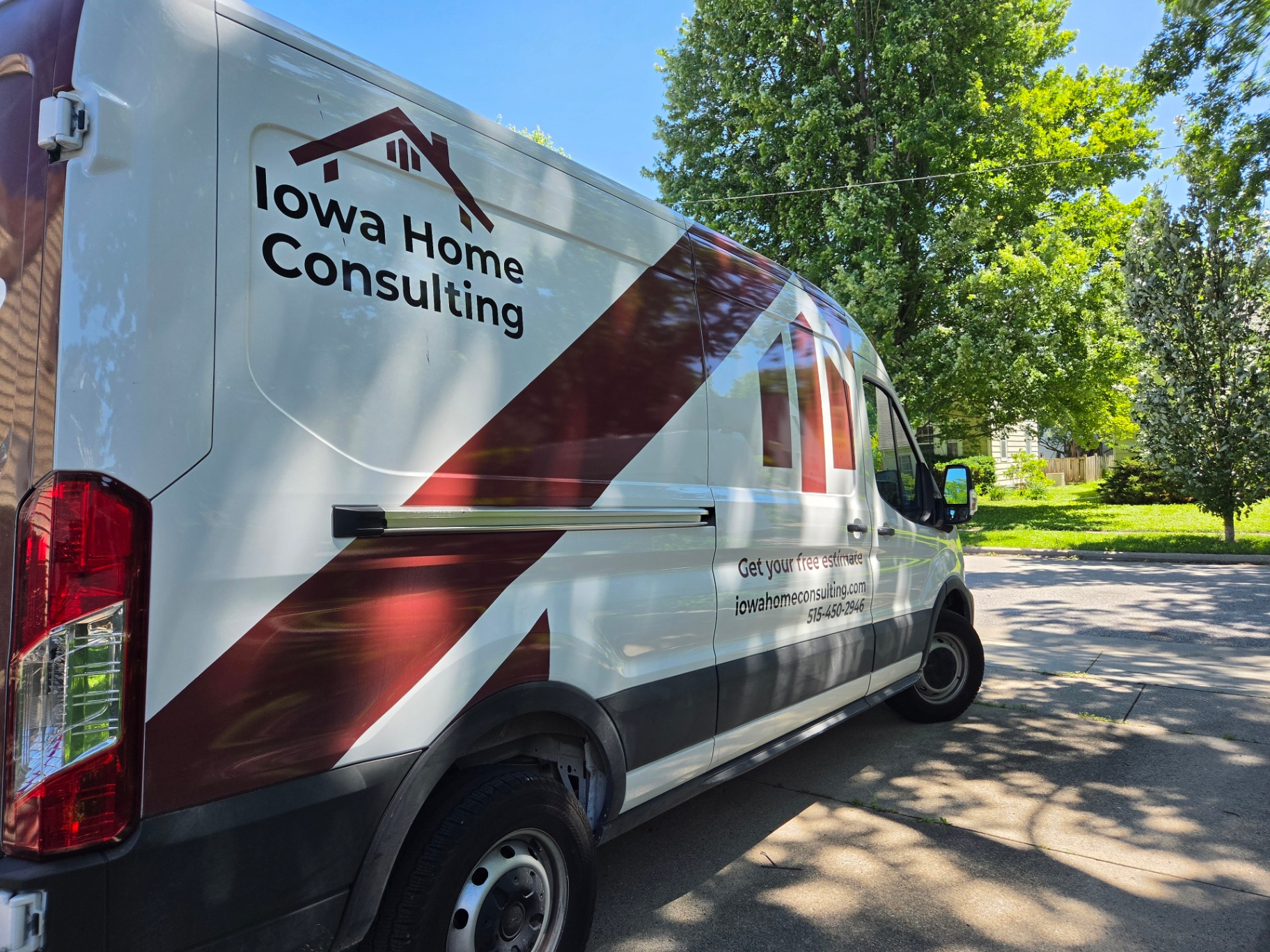 Iowa Home Consulting work van on a residential street